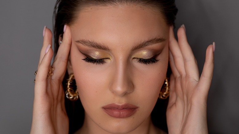 A woman with glitter eye shadow