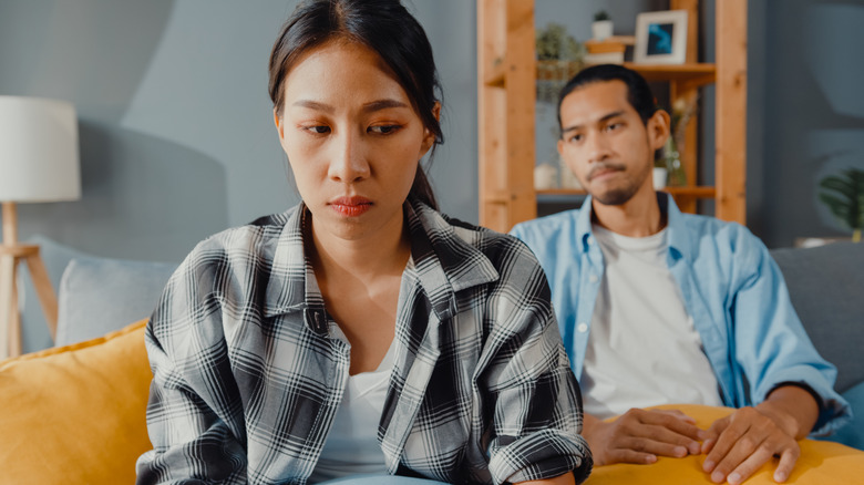 Unhappy couple turned away from each other