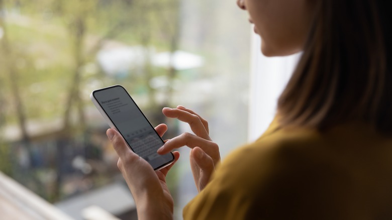 Woman typing a text