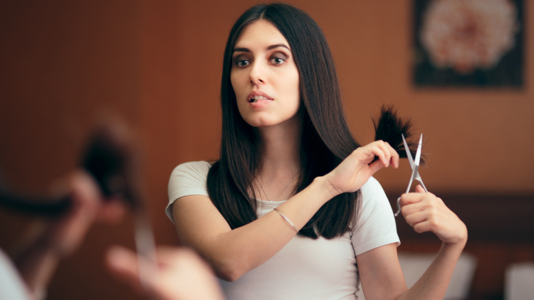 Woman preparing to cut hair