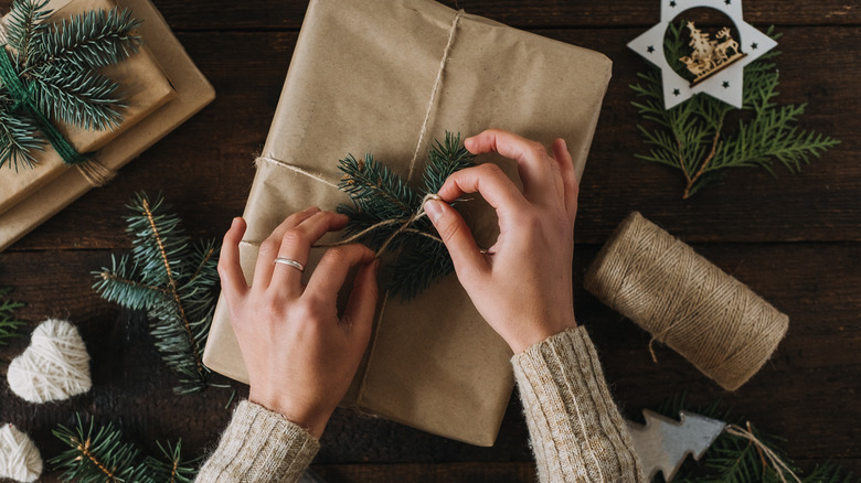 woman wrapping christmas presents 