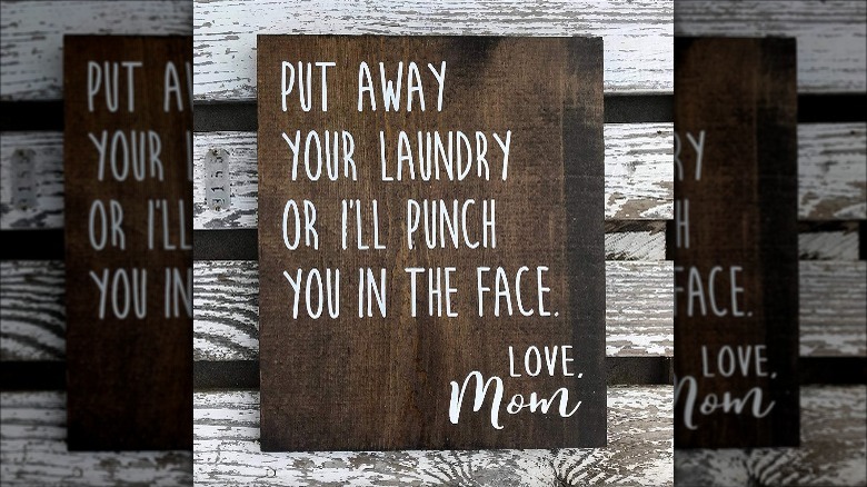 "Put away your laundry" on distressed wood background; mirror border