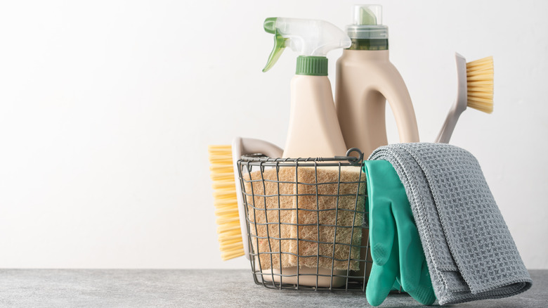 wire basket filled with cleaning products