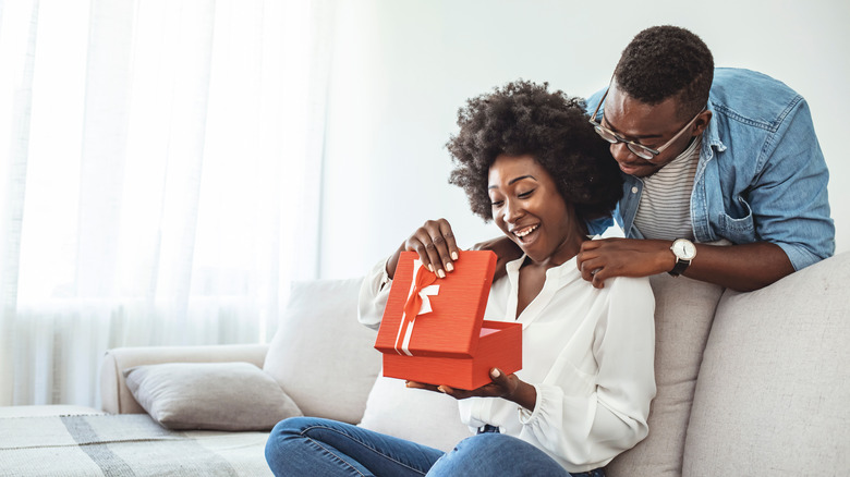 boyfriend gifting girlfriend a gift box