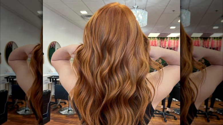 Woman showing off copper hair