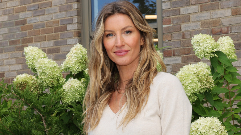 Gisele Bündchen posing in white