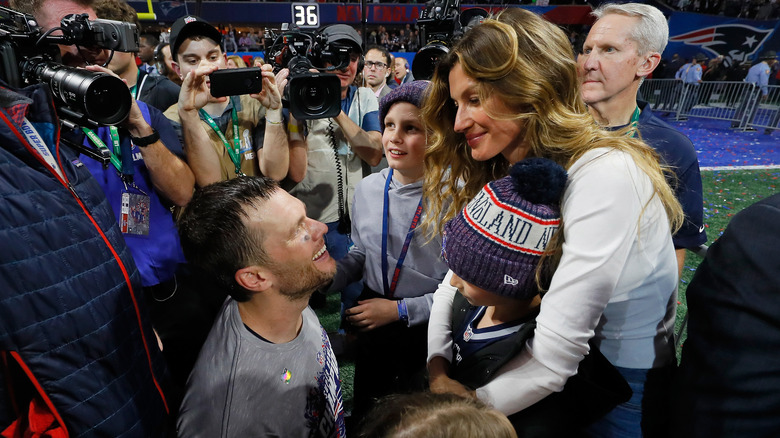 Tom Brady and wife Gisele Bunchen following a New England Patriot's football game 