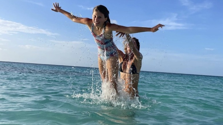 Vivien Brady being tossed in ocean by Gisele Bündchen