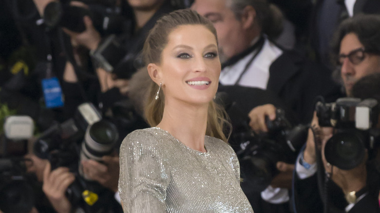 Gisele Bundchen smiling for photographers