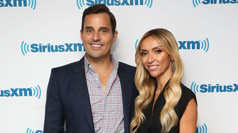 Bill and Giuliana Rancic posing together in formal attire