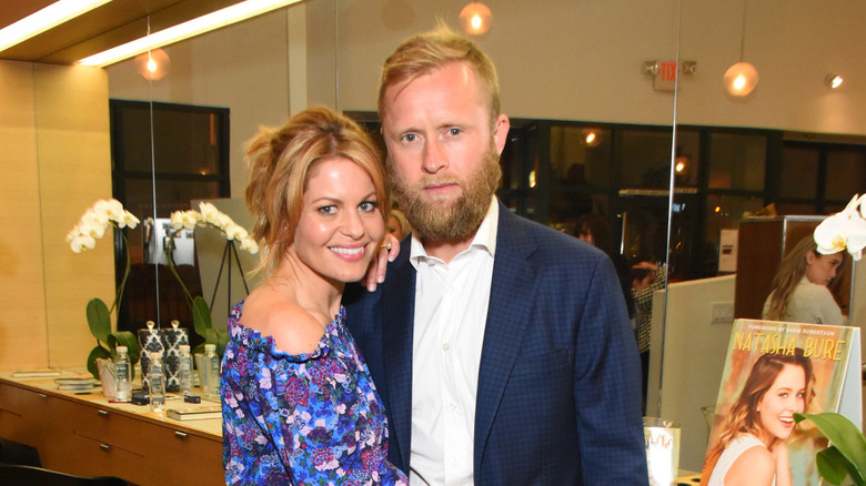 Candace Cameron Bure and Valeri Bure posing for a photograph