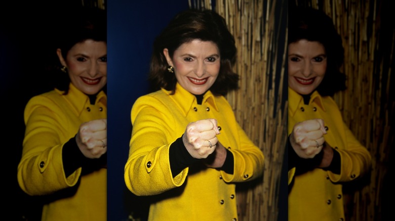Gloria Allred holding up her fists
