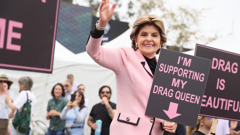 Gloria Allred holding a sign that says I'm Supporting My Drag Queen