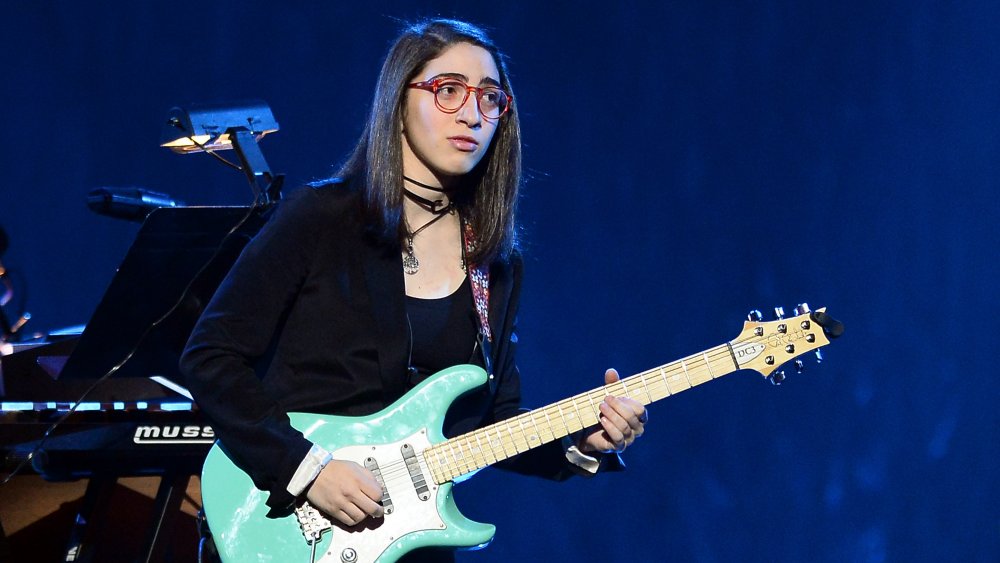 Gloria Estefan's daughter, Emily Estefan, playing guitar in 2014