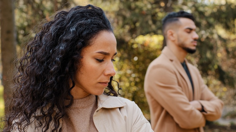 Woman looking upset with partner