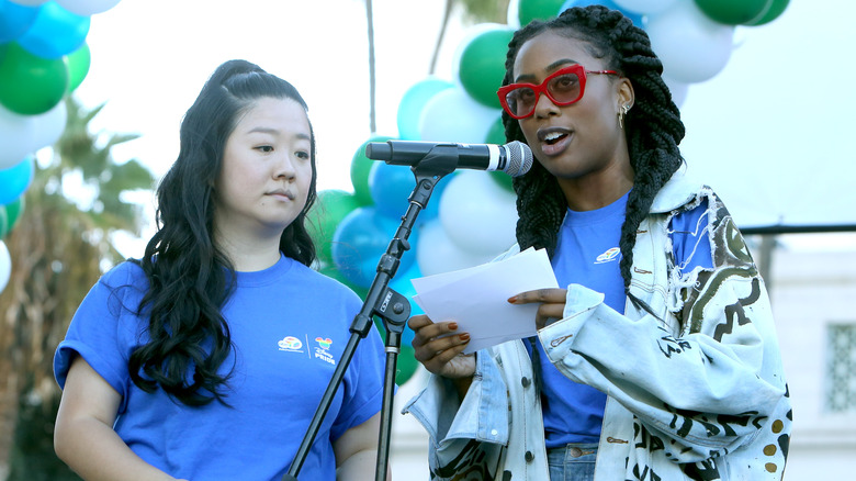 Zuri Adele speaking into a microphone