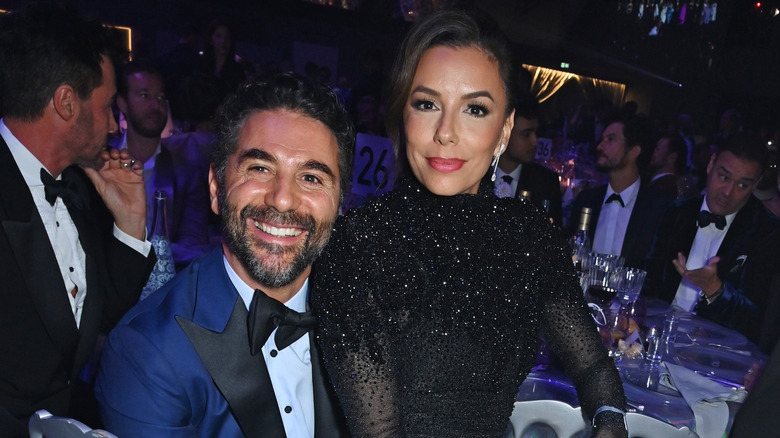 Eva Longoria sitting on José Bastón's lap