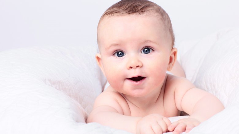 smiling baby with blue eyes