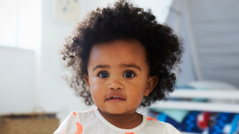 sweet little girl with dark curly hair