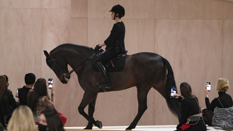 Charlotte Casiraghi on horseback on the runway during the Chanel Haute Couture Spring/Summer 2022 show as part of Paris Fashion Week