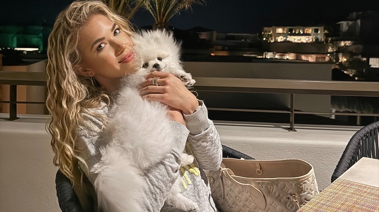 Gracie Hunt holds pet teacup Pomeranian