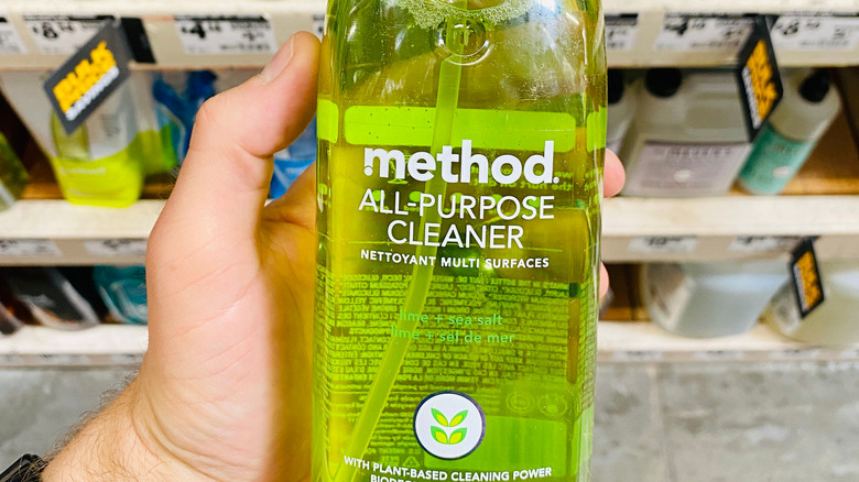 Person holding Method brand all-purpose cleaner