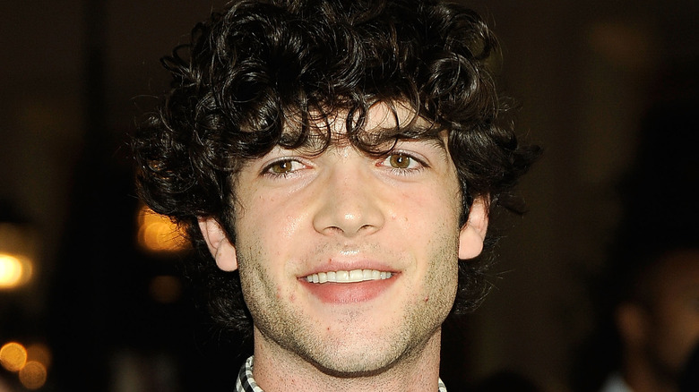 Ethan Peck smiling at an event