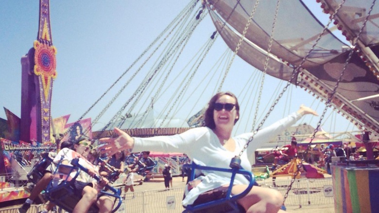 Marisa Peck on a carnival swing ride