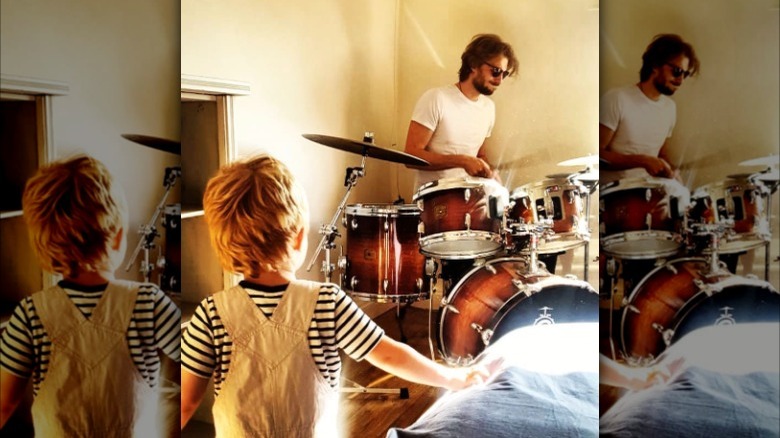 Zack Peck playing drums and his son Atticus