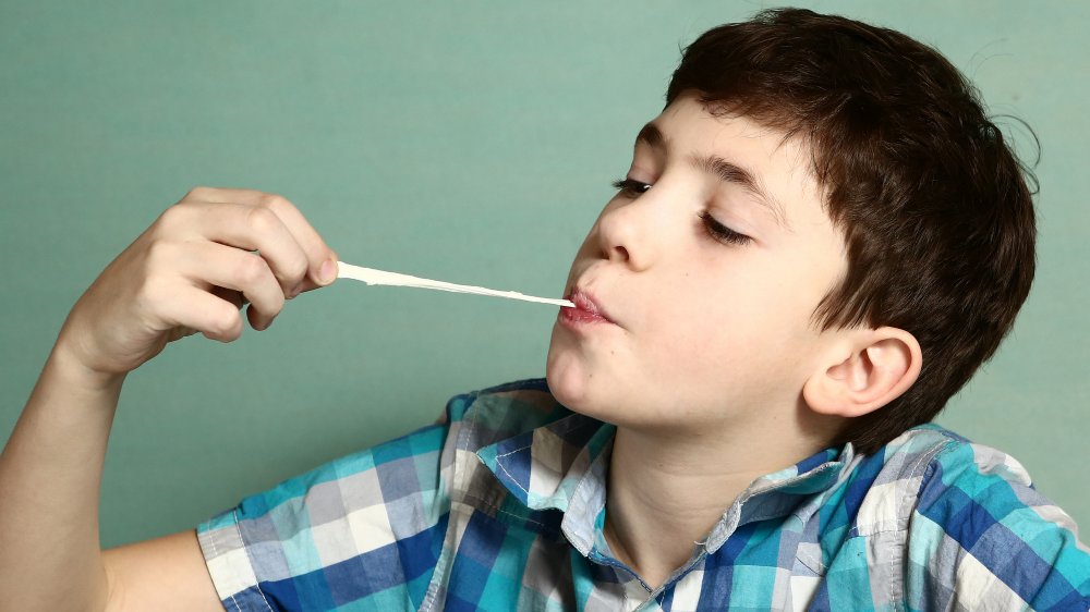 boy playing with gum