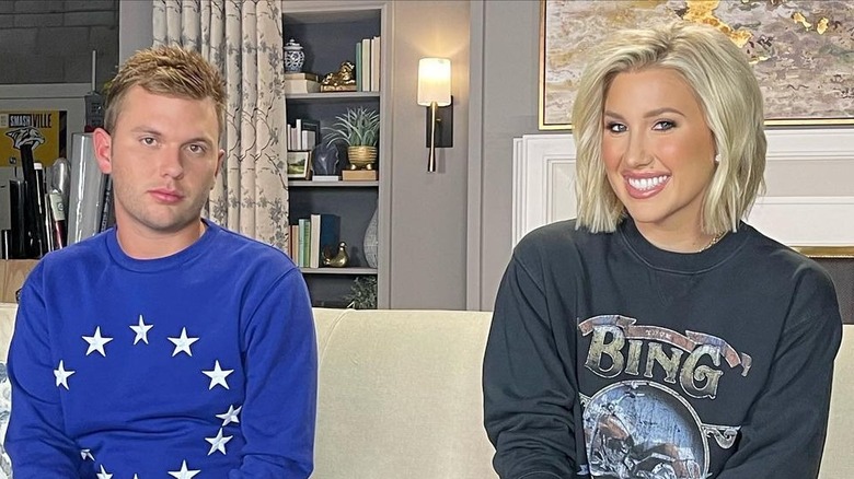 Savannah and Chase Chrisley pose during filming