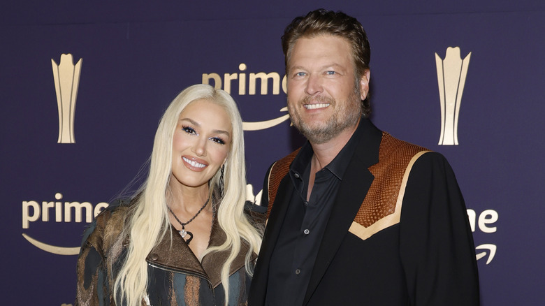 Gwen Stefani and Blake Shelton smiling at the 59th ACMs