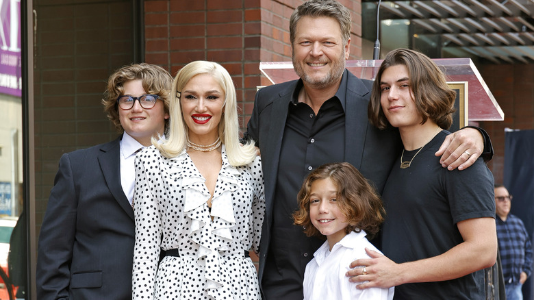 Gwen Stefani and kids smiling with Blake Shelton