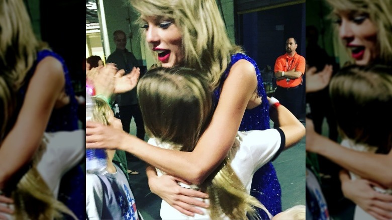Apple Martin hugging Taylor Swift