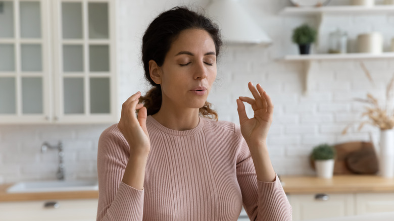 a woman deep breathing