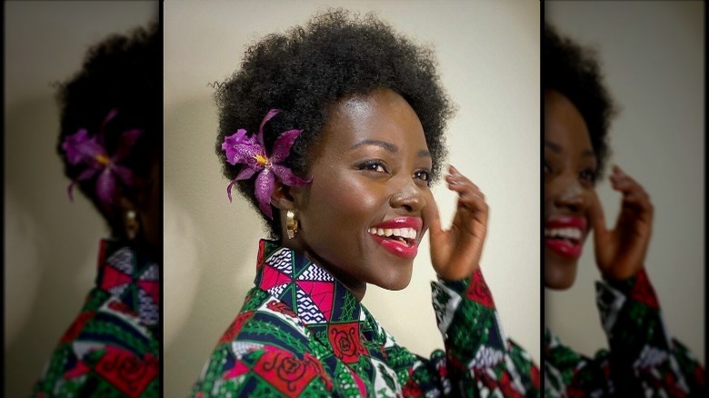 Actress Lupita Nyong'o with an orchid in her hair