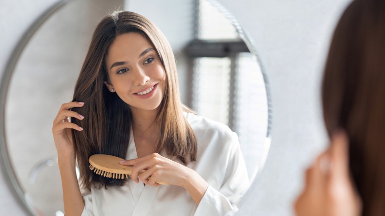 A woman brushing her hair 