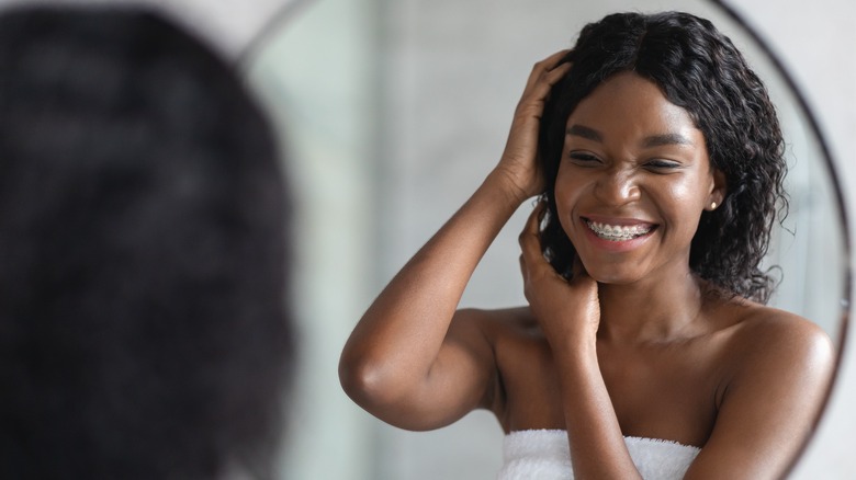 woman massaging scalp, massaging healthy hair