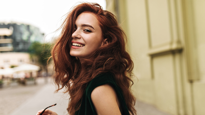 Woman with curly hair smiling