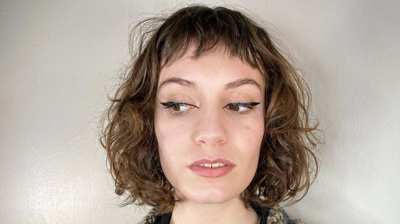 curly hair with micro bangs