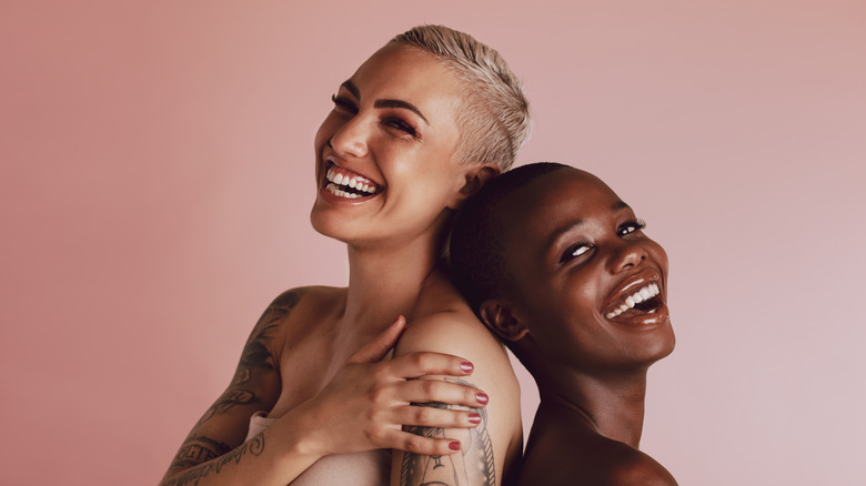 Smiling women with buzz cuts