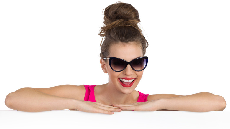 Woman with big topknot smiling