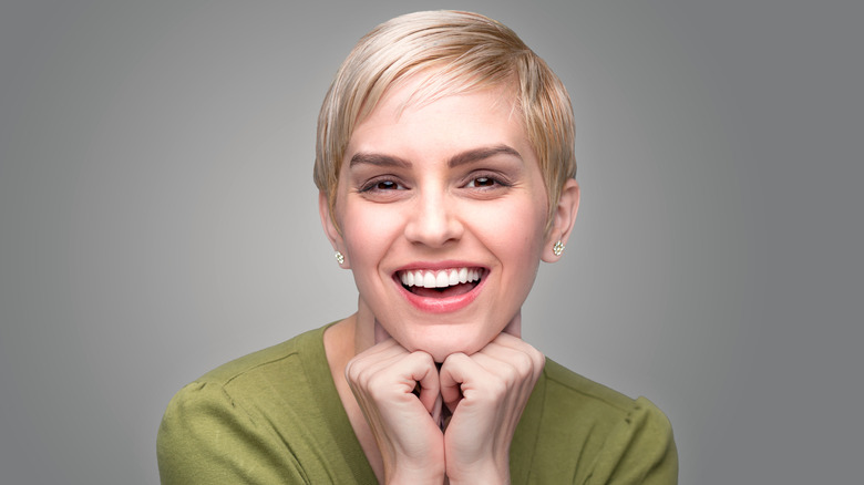 Smiling woman with pixie cut