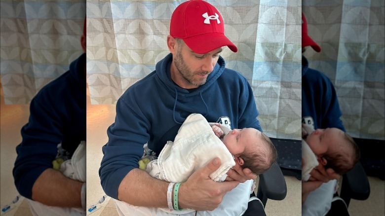 Luke Macfarlane holding baby daughter Tess