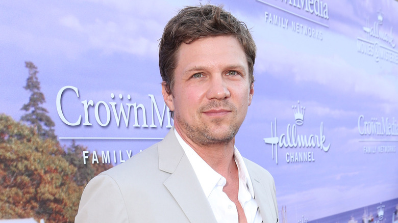 Marc Blucas in front of Hallmark logos