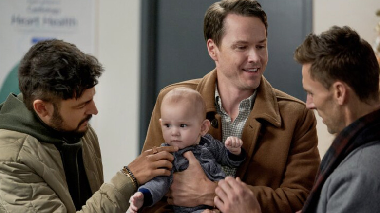 Tyler Hynes, Paul Campbell, Andrew Walker, and baby in Three Wise Men and a Baby