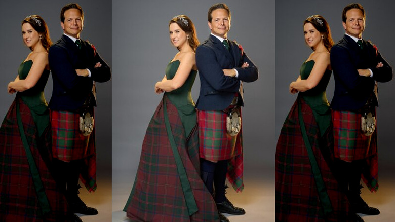 Hallmark's Lacey Chabert and Scott Wolf posing in Scottish clothing