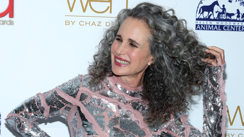 Andie MacDowell fluffing her gray curls