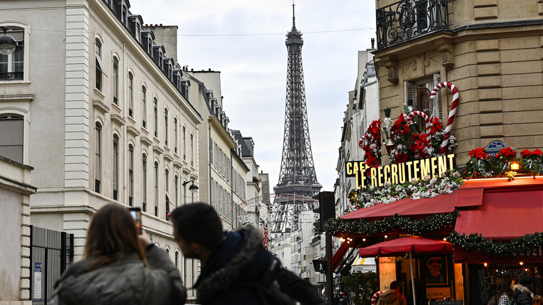 Eiffel Tower looms behind Christmas decorations