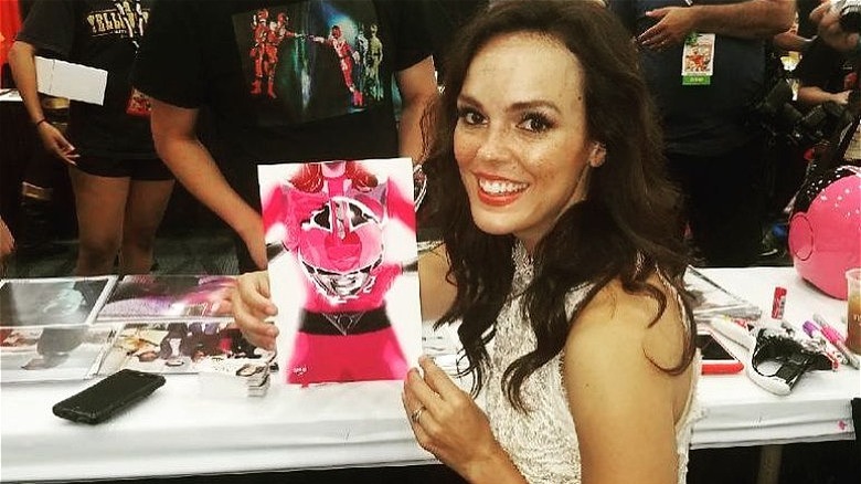 Erin Cahill holding pink power ranger poster